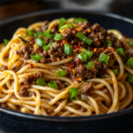 Mongolian Ground Beef Noodles in a white bowl